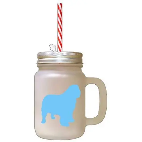 Bouteille en verre Mason bleu clair avec silhouette de spaniel Clumber et paille. Bouteille en verre Mason bleu clair avec silhouette de spaniel Clumber et paille.
