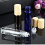 3PCS 10ml/0.34oz Empty Refillable Blue Glass Roll-on Bottles with Stainless Steel Roller Balls Wood Grain Cap Portable Cosmetic Containers Jar Pot Vials Holder for Essential Oil Perfume