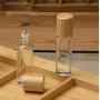 3PCS 10ML 0.3OZ Transparent Empty Roller Bottles with Stainless Steel Roller Balls and Bamboo Cover Essential Oil Perfume Holder Jar Pot Portable Refillable Container for Travel Daily Life