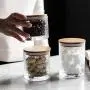 Bouteille en verre étanche avec couvercle en bambou pour stockage de snacks, café, contenants alimentaires pour la maison et la cuisine. Bouteille en verre étanche avec couvercle en bambou pour stockage de snacks, café, contenants alimentaires pour la maison et la cuisine.