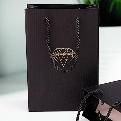 Handmade high quality guarantee gold stamping paper gift packaging bag with custom logo and handles