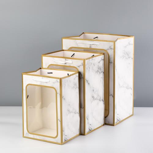 Sacs cadeaux en papier blanc de luxe, portables, design novateur, vente en gros. Sacs cadeaux en papier blanc de luxe, portables, design novateur, vente en gros.