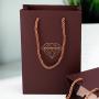 Handmade high quality guarantee gold stamping paper gift packaging bag with custom logo and handles