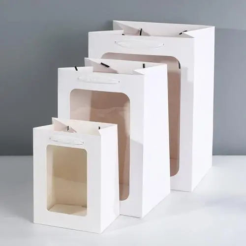 Sacs Cadeaux Blancs Portables de Luxe, Design Nouveau, en Papier Carton avec Poignées (Vente en Gros) Sacs Cadeaux Blancs Portables de Luxe, Design Nouveau, en Papier Carton avec Poignées (Vente en Gros)