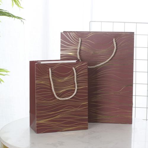 Wholesale Simple Delicate Gold Stamping Printed Paper Gift Packaging Bag With Custom Design Logo