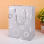 Wholesale Custom High Quality Ivory Board Handle Simple Paper Gift Bags Packaging For Shopping