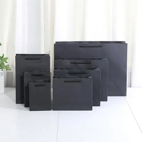 Sacs cadeaux en papier kraft écologique en gros, sacs pour vêtements, papier pour shopping, avec logo personnalisé. Sacs cadeaux en papier kraft écologique en gros, sacs pour vêtements, papier pour shopping, avec logo personnalisé.