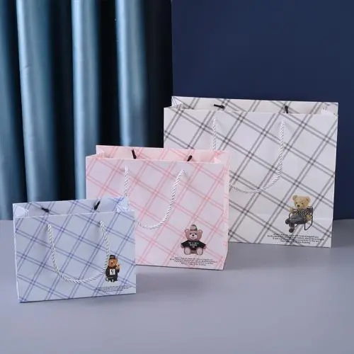 Sac en papier de grande capacité imprimé, mignon, délicat, écologique, économique, avec logo personnalisé. Sac en papier de grande capacité imprimé, mignon, délicat, écologique, économique, avec logo personnalisé.