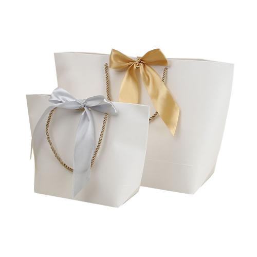 Hot Selling Custom Logo Lovely Fancy Shopping Bag Recycled Wedding Premium Jewelry Gift Packaging Paper Bag With Ribbon Bow Tie