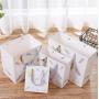 Wholesale Manufacture Custom Logo Printed Reusable Portable Paper Gift Packaging Bag