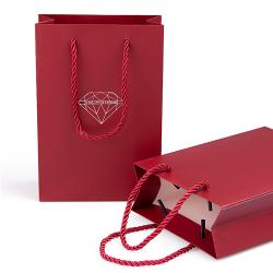 Handmade high quality guarantee gold stamping paper gift packaging bag with custom logo and handles