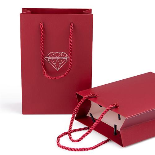 Handmade high quality guarantee gold stamping paper gift packaging bag with custom logo and handles