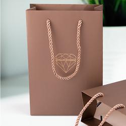 Handmade high quality guarantee gold stamping paper gift packaging bag with custom logo and handles