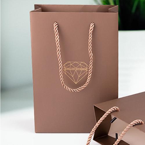 Handmade high quality guarantee gold stamping paper gift packaging bag with custom logo and handles