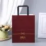 Sac en papier de luxe personnalisé avec prix réduit pour shopping, avec anses en ruban. Sac en papier de luxe personnalisé avec prix réduit pour shopping, avec anses en ruban.