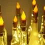 Decorman Weinflaschen Korkleuchten mit Kerzenflamm 10er Pack 20 LED Warme Weiß Batteriebetriebene Kupferdraht Sterne Lichter Mini Funkeln Lichter für Party, Hochzeit, Weihnachten, Halloween (Warme Weiß)